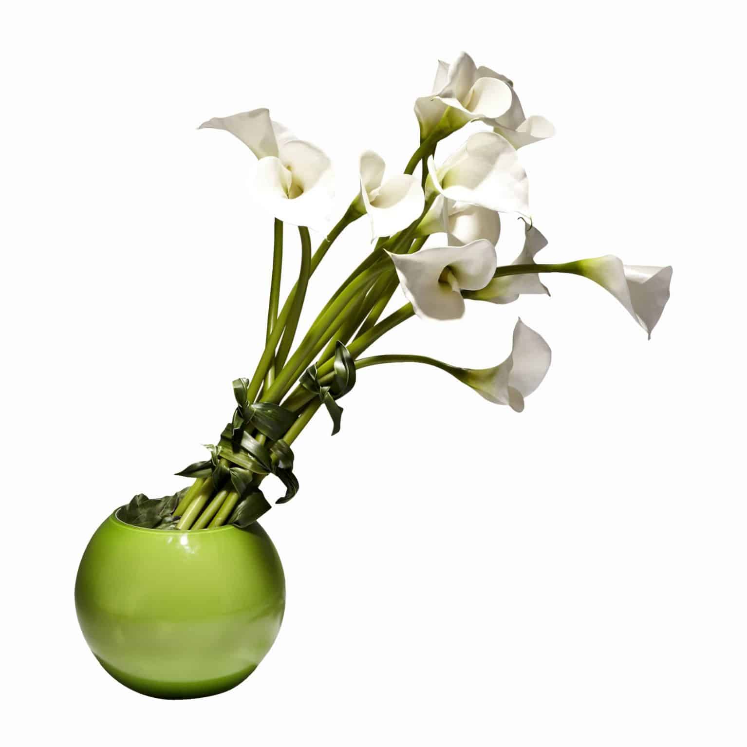 Buy our modern arrangement of fine silk lily flowers in a vibrant green bowl vase. Brighten everyone's day with this stunning faux flower arrangement.