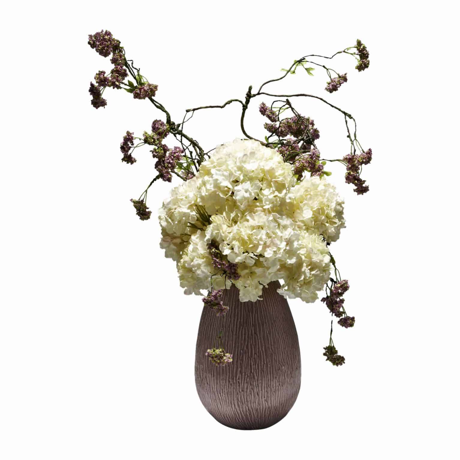 Shop for our premium quality cream silk hydrangea flowers arranged in a dome broken up with artificial purple snowball garland in a deep pink ceramic pot.