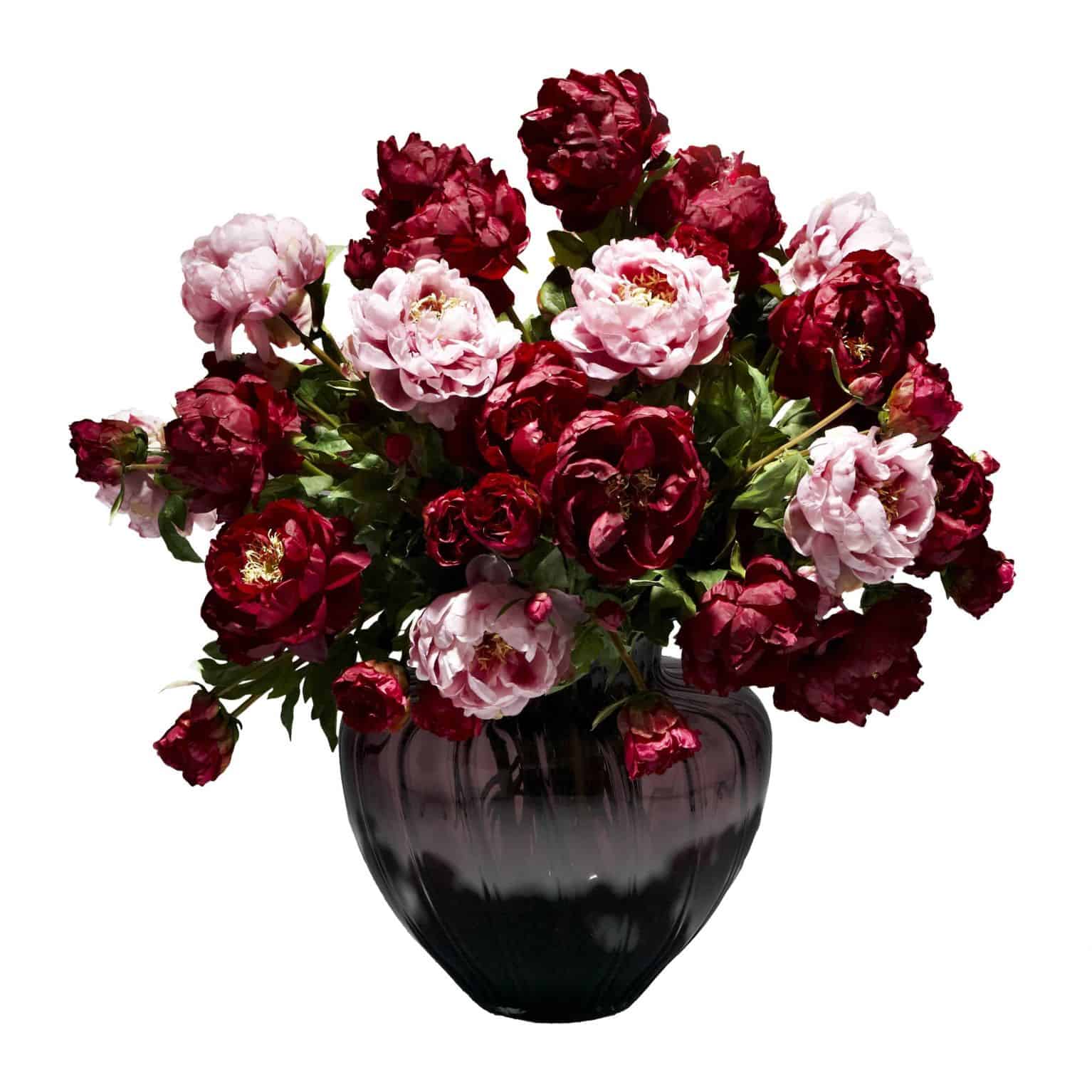 Shop for our lavish display of silk peony flowers in lavender and rich burgundy. Inspired by the paintings of extravagant blooms