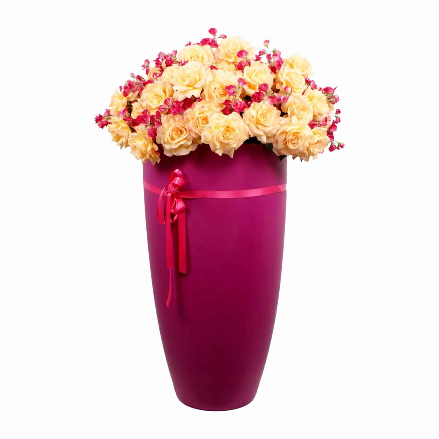 Buy sunshine! Yellow tea rose silk flowers layered with soft petals and artificial sweet pea flowers its summer in a pot with this lovely arrangement.