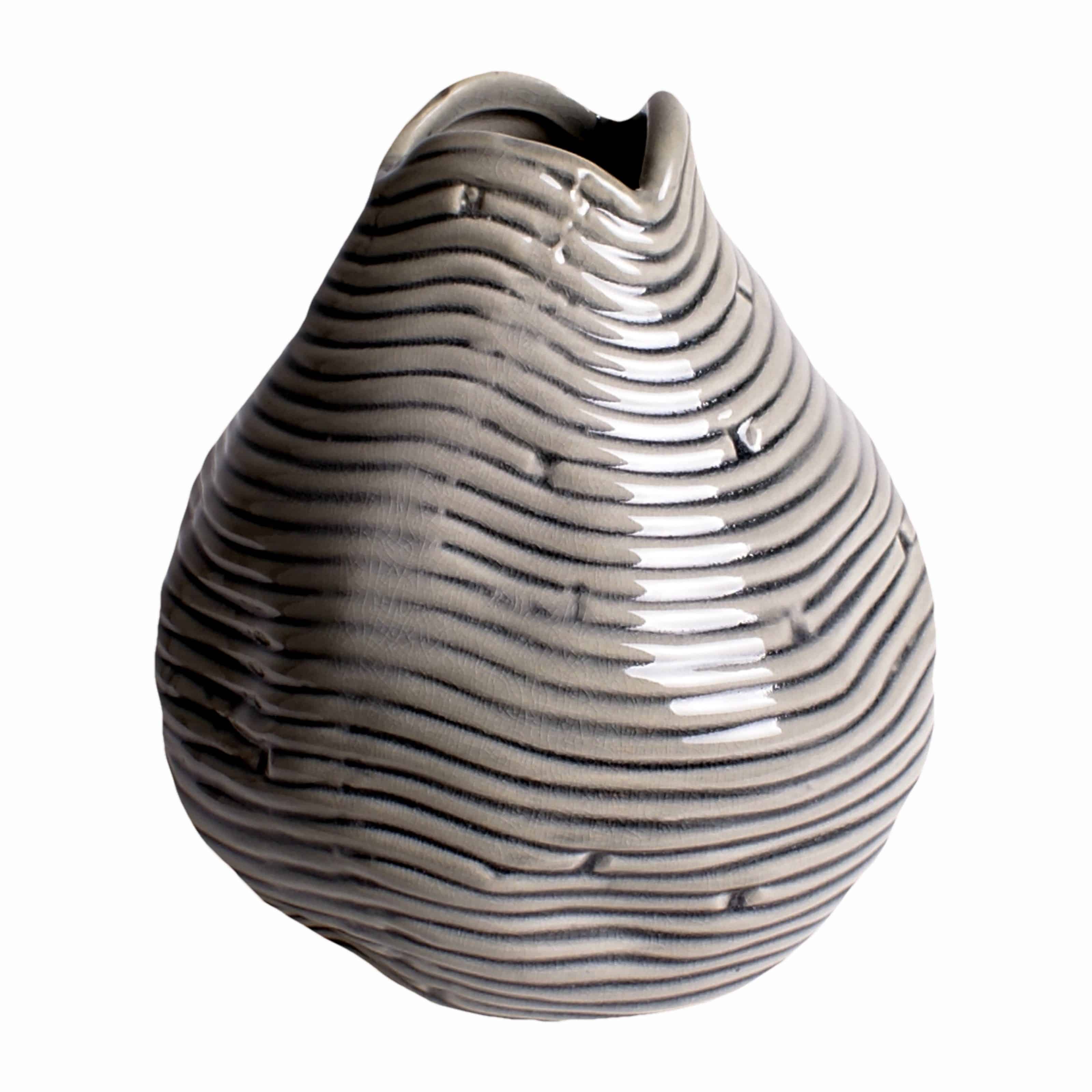 Buy our unique teardrop handmade vase. A decorative grey design creating differing shades Perfect for a few silk flower stems or branches for stylish decor.